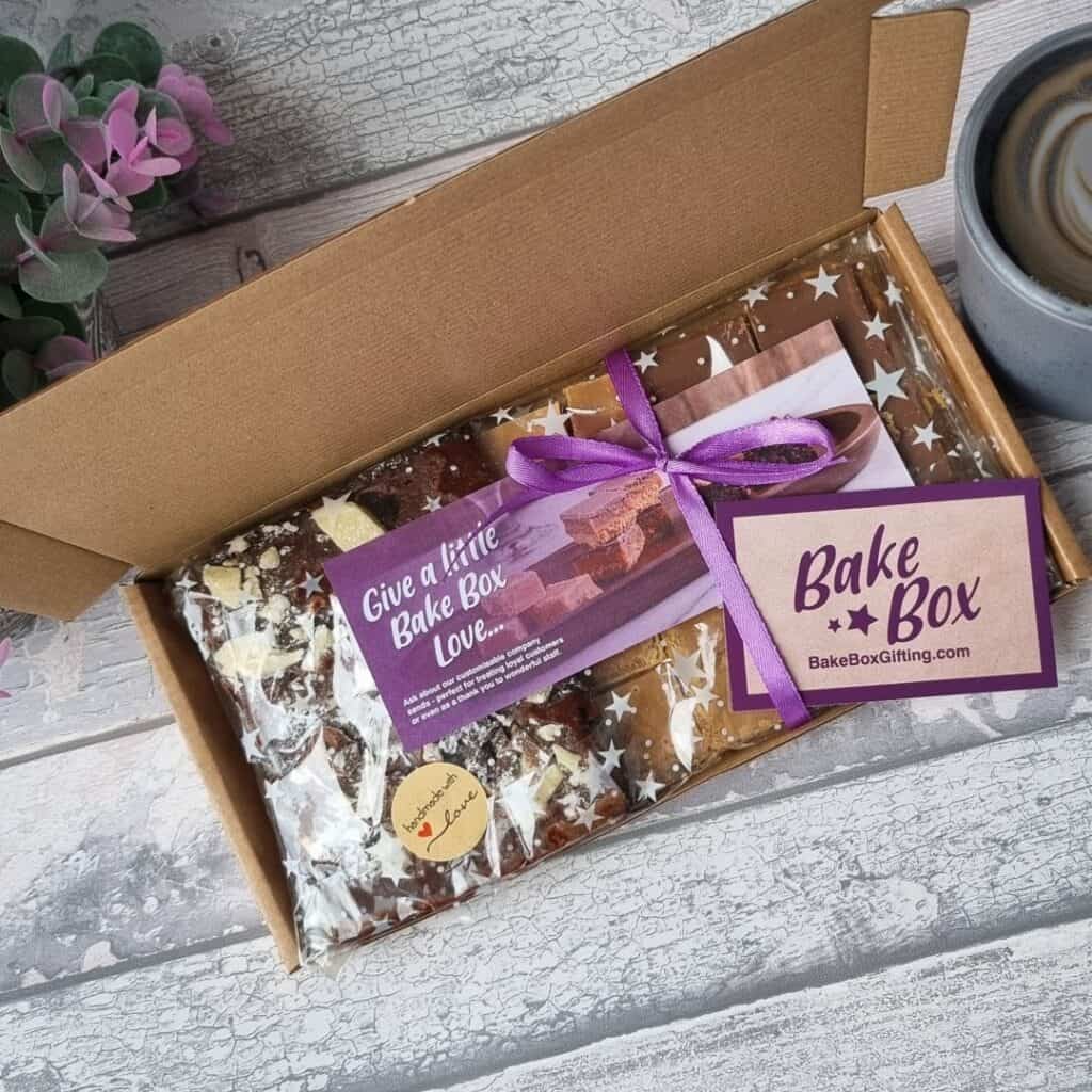 BakeBox Gift showing trio of treats beautifully presented in fully compostable and recyclable packaging including cellophane and cardboard box.