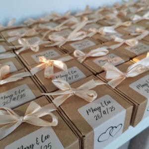 Rows of Scottish Tablet Treat Boxes by BakeBox Gifting tied with blush coloured ribbon
